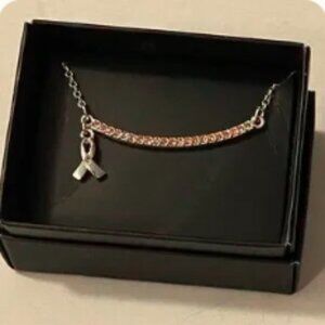 Never worn. Still in box. Avon Pink Hope Ribbon Necklace